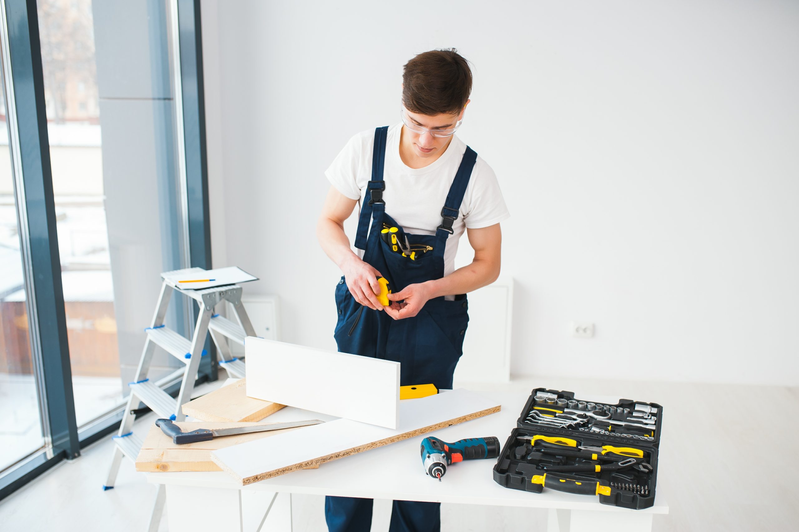A handyman busy repairing an apartment