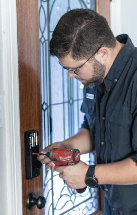 Handyman Installing a smart lock into door