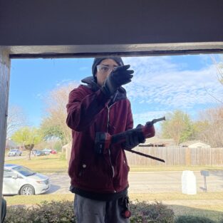 Handyman working on installing a window