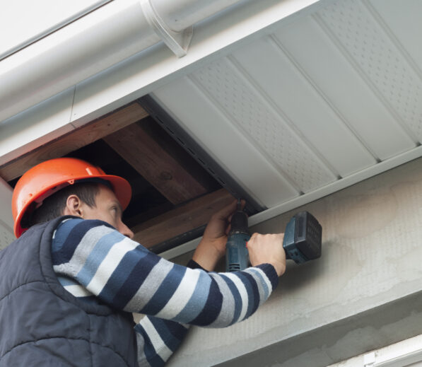 Handyman fixing a soffit