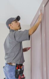 Handyman doing drywall patching custom accent wall